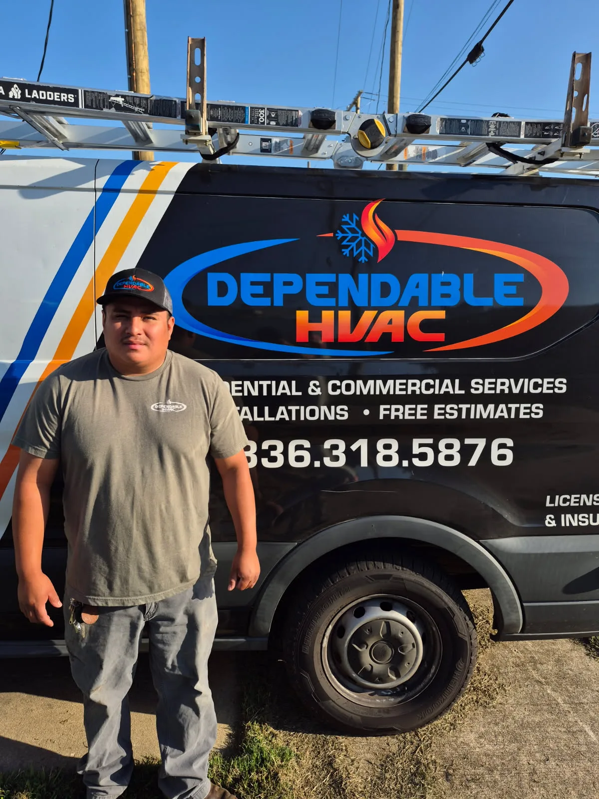 Dependable HVAC technician standing by service van in Wadeville